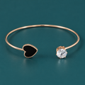 Hrida Black Heart Gold-Tone Cuff Bracelet | MyJhumki