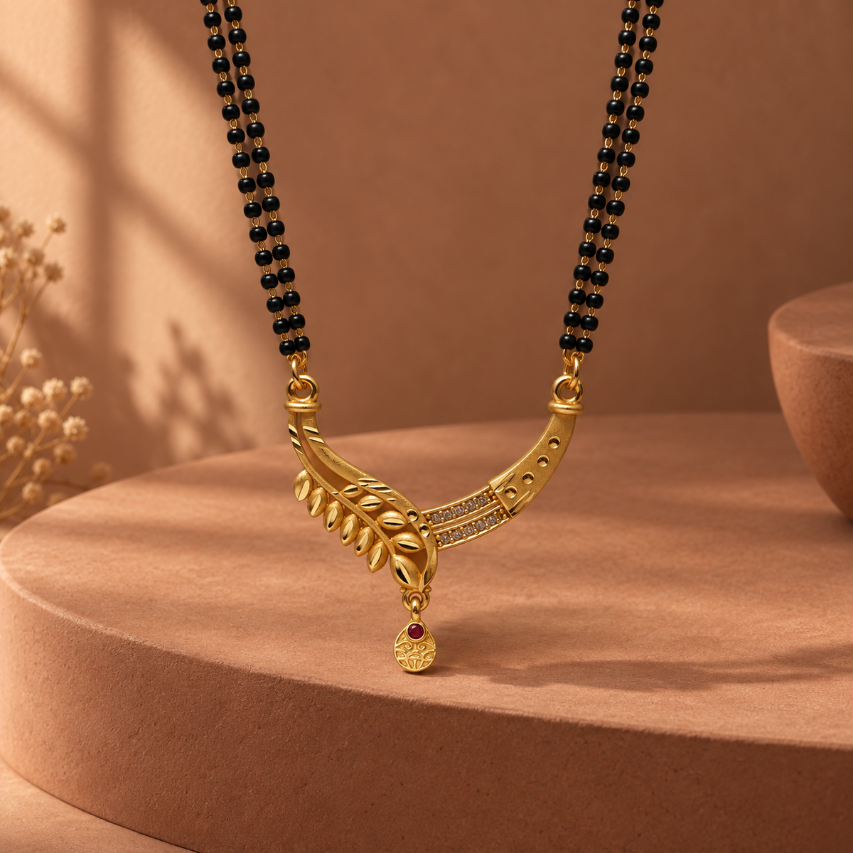 Aarohi Leaf Arc Mangalsutra photographed in a terracotta studio setting