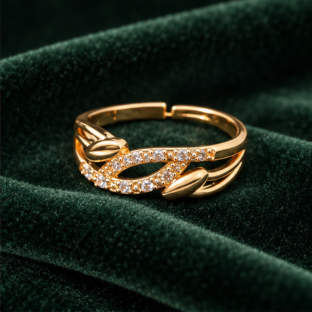 Ananta Leaf Infinity Sparkle Gold-Tone Ring on a forest green velvet backdrop