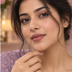 Model wearing the Ananta Leaf Infinity Sparkle Gold-Tone Ring — close-up