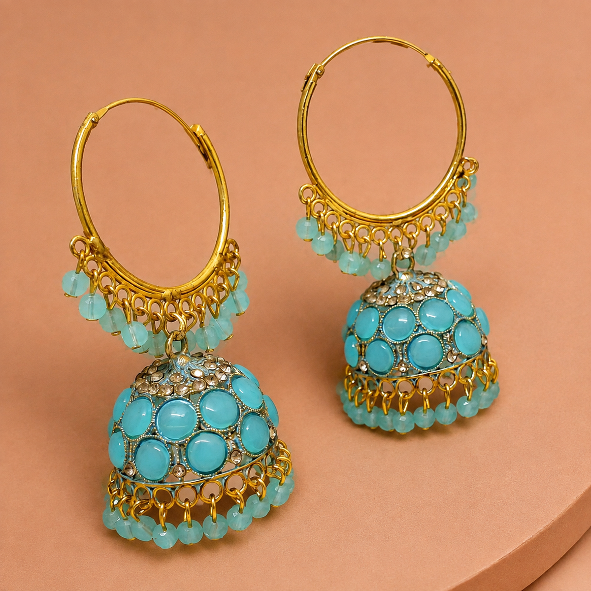 Aqua Noor Hoop Jhumka Earrings – Gold-Tone Beaded Design on a clay display stand