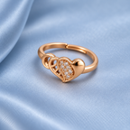 Dilruba Interlocking Heart Rose Gold-Tone Ring on a powder blue satin backdrop