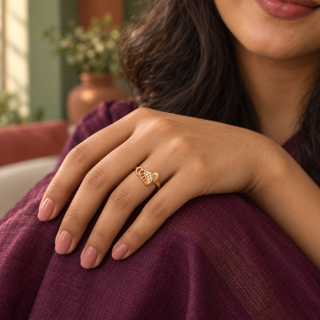 Model wearing the Dilruba Interlocking Heart Rose Gold-Tone Ring — close-up