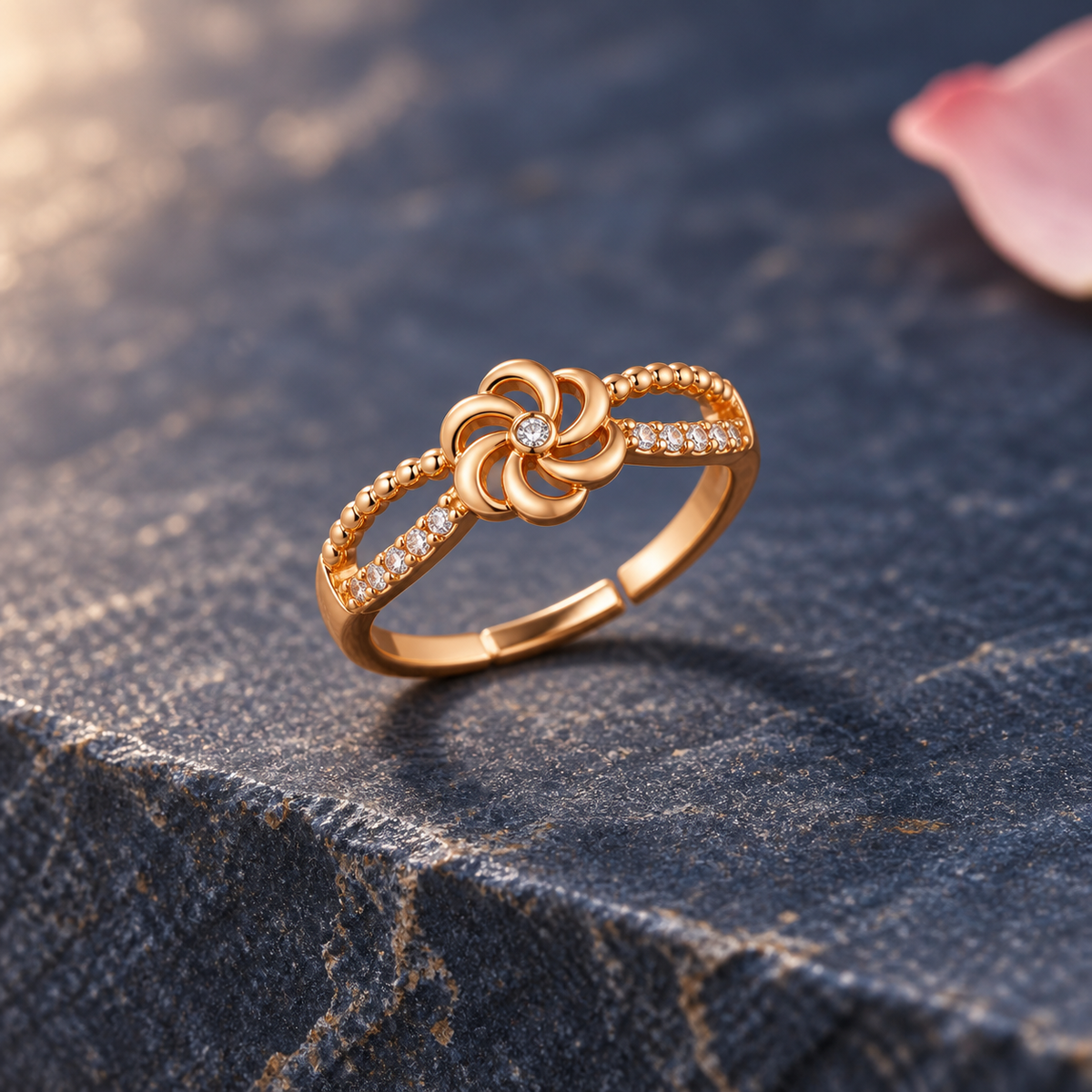 Gulnaar Pinwheel Floral Rose Gold-Tone Ring on an indigo stone backdrop