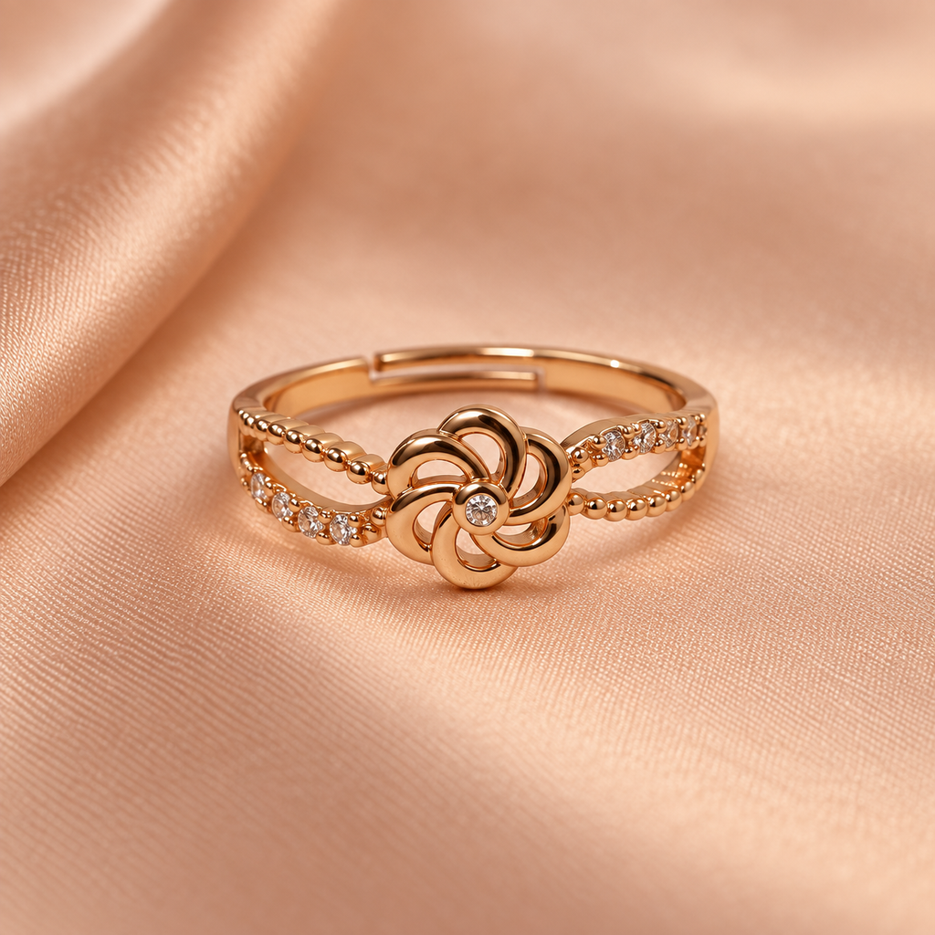 Gulnaar Pinwheel Floral Rose Gold-Tone Ring on a champagne satin backdrop