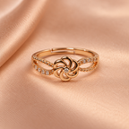 Gulnaar Pinwheel Floral Rose Gold-Tone Ring on a champagne satin backdrop