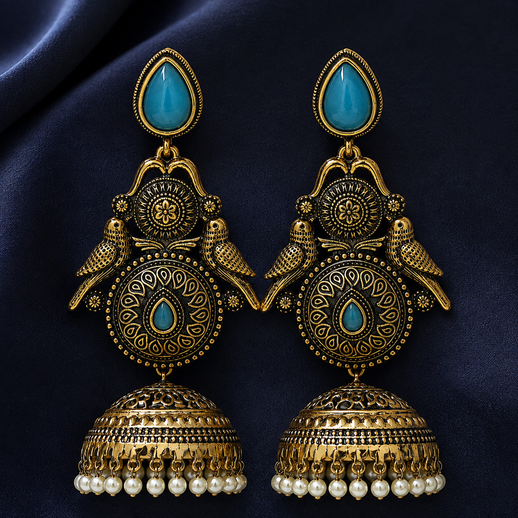 Mayur Neel Antique Peacock Jhumka Earrings on an indigo satin backdrop