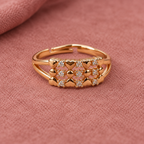 Meher Floral Lattice Rose Gold-Tone Ring on a rose suede backdrop