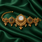 Meher Peacock Fan Kashmiri Jewellery Watch on an emerald silk backdrop