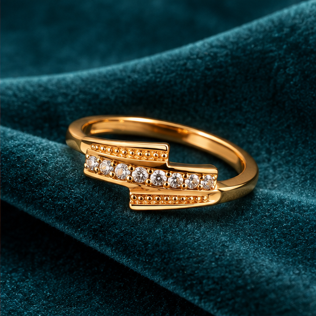 Meher Staggered Sparkle Gold-Tone Ring on a teal velvet backdrop
