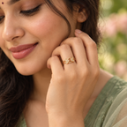 Model wearing the Milan Double Heart Infinity Gold-Tone Ring — close-up