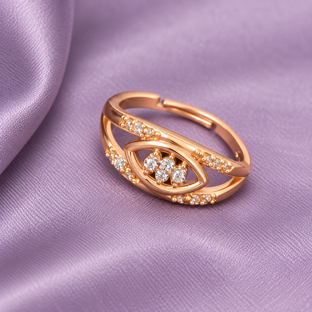 Naina Sparkle Rose Gold-Tone Crossover Ring on a lavender satin backdrop