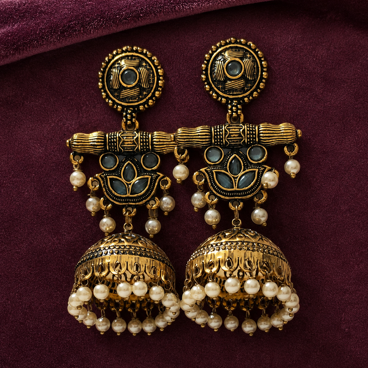 Neel Kamal Antique Lotus Jhumka Earrings on a plum velvet backdrop
