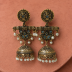 Neel Kamal Antique Lotus Jhumka Earrings on a rose clay backdrop