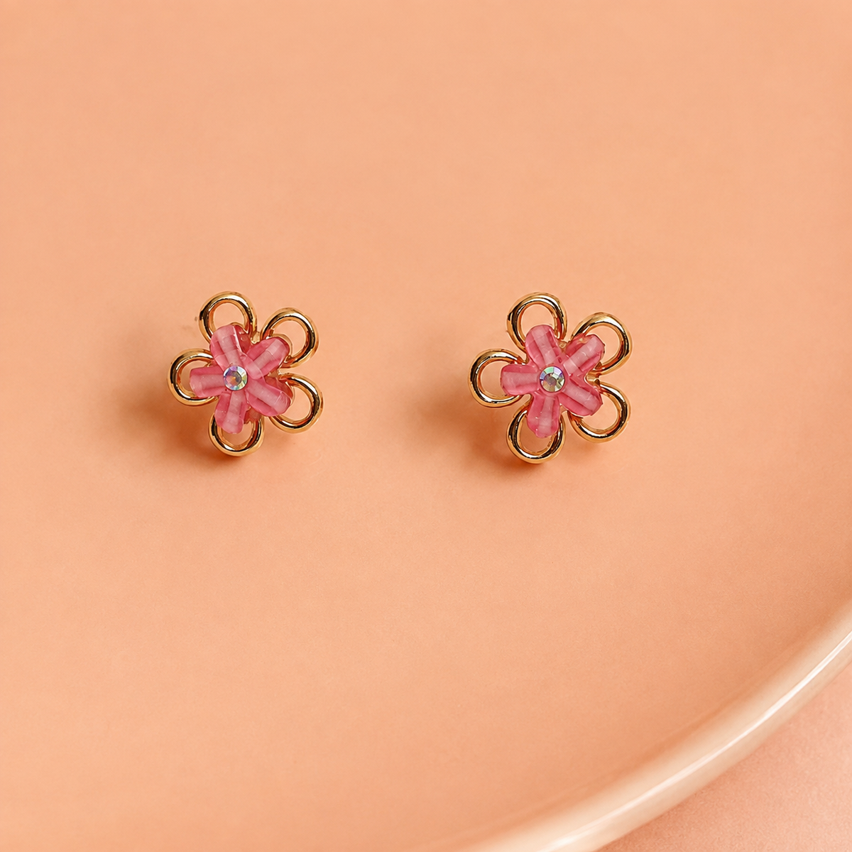 Petal Pop Pink Flower Stud Earrings – Gold-Tone on a peach ceramic backdrop