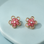 Petal Pop Pink Flower Stud Earrings – Gold-Tone on an aqua display stand