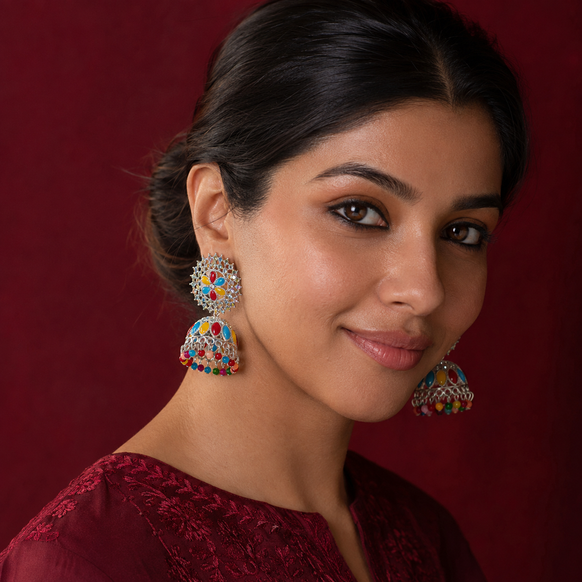 Rangoli Bloom Multicolour Jhumka Earrings – Silver-Tone Floral Design worn by a model