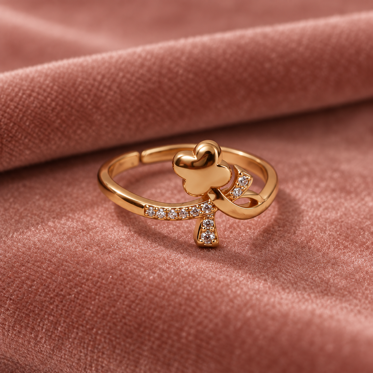 Titli Sparkle Butterfly Ribbon Rose Gold-Tone Ring on a dusty rose velvet backdrop