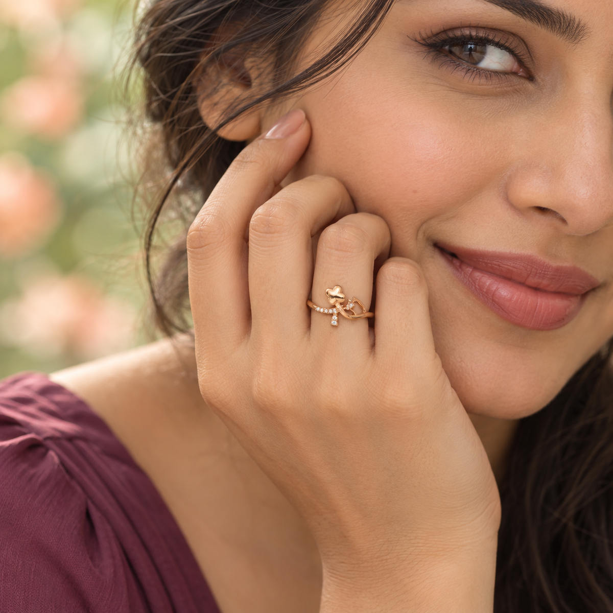 Model wearing the Titli Sparkle Butterfly Ribbon Rose Gold-Tone Ring — close-up