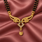 Vanya Diamond Wing Gold-Tone Mangalsutra on an antique rose silk backdrop